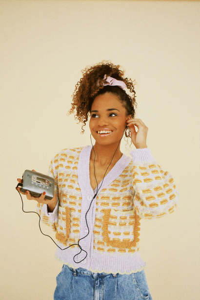 Woman with Walkman on Beige Background